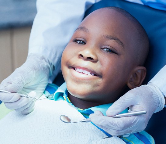 Child smiling at dental checkup